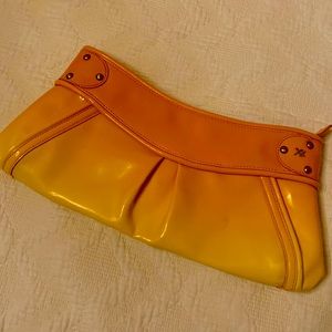 Maxx New York orange- yellow ombré clutch with tiger print interior